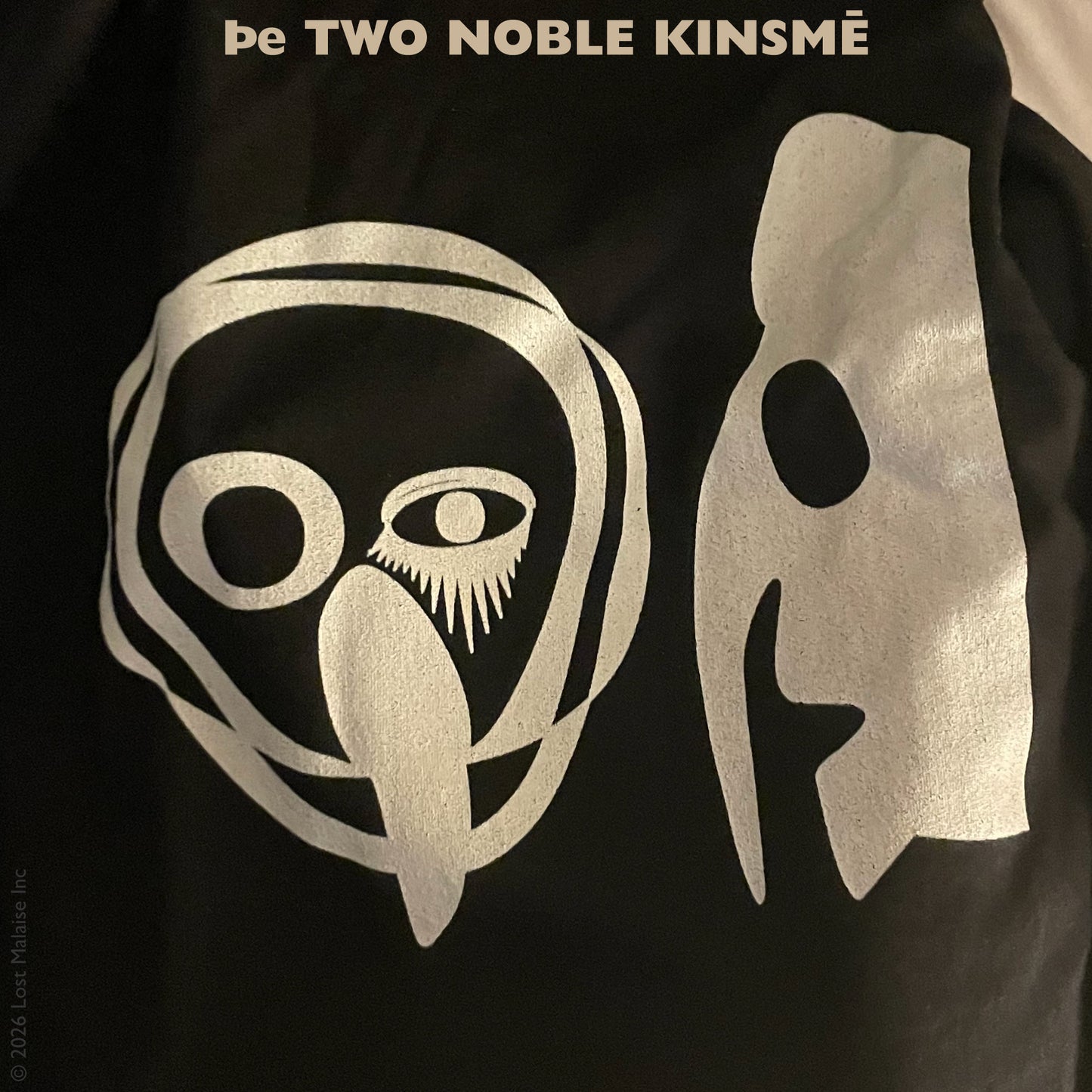 Cover artwork for The Two Noble Kinsmen in the Fifth Folio edition featuring stark white abstract figures and mask-like forms rendered in a minimalist theatrical style on a baseball tee shirt.